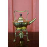 An Arts and Crafts brass spirit kettle on stand