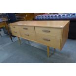 A teak six drawer sideboard