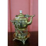 An Arts and Crafts brass spirit kettle on stand