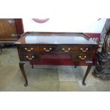 An Edward VII mahogany four drawer writing table