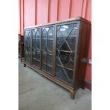 An Edward VII Maple & Co. mahogany and astragal glazed four door bookcase, 119cms h, 185cms w, 41cms