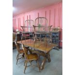 A Gothic style oak x-frame refectory table and a set of six elm and oak Windsor chairs