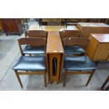 A McIntosh teak drop leaf table and four chairs