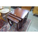 A faux rosewood nest of tables