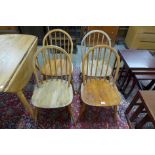 A set of four Ercol Blonde elm and beech Windsor chairs