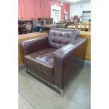 A Knoll style chrome and brown leather armchair