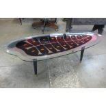 An Italian ebonised and glass topped coffee table