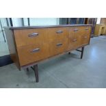 A teak four drawer sideboard