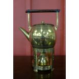 An Arts and Crafts brass spirit kettle on stand