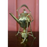 An Arts and Crafts brass spirit kettle on stand