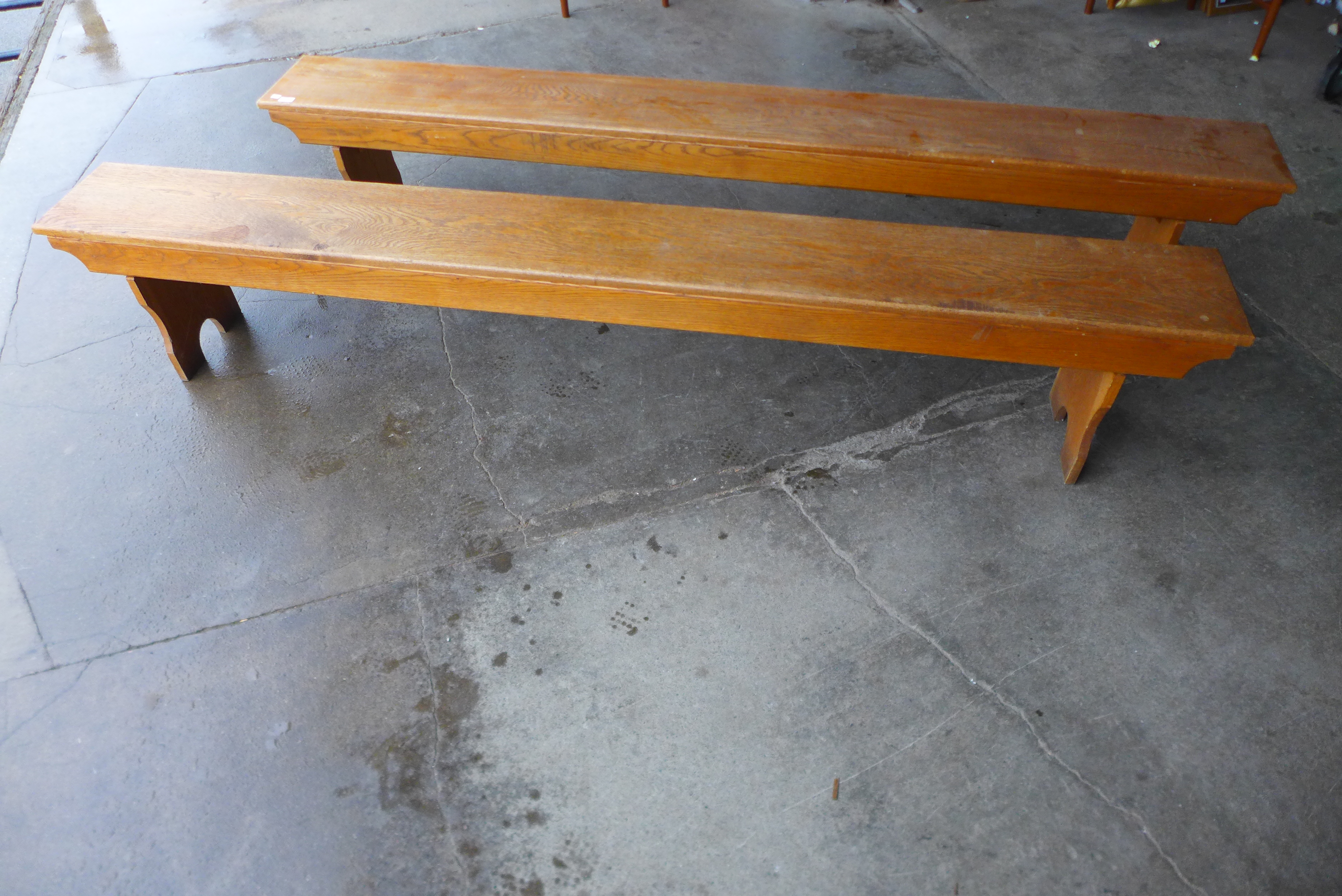 A pair of vintage oak school gymnasium benches