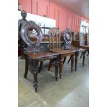 A pair of Victorian mahogany hall chairs and one other