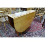 A McIntosh teak drop leaf table