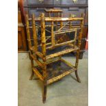 A Victorian Aesthetic Movement bamboo and black Japanned newspaper stand