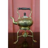 An Arts and Crafts brass spirit kettle on stand