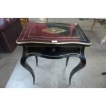 A French Napoleon III ebonised and brass inlaid lady's vanity dressing table