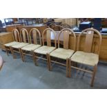 A set of six Danish ash and cord seated dining chairs