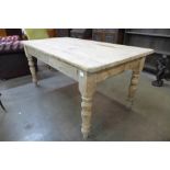 A Victorian style scrub top pine farmhouse kitchen table