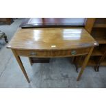 A George III mahogany bow front two drawer side table