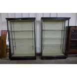 A pair of Victorian ebonised open shop display cabinets, 198cms h, 129cms w, 39cms d