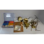 Live steam fittings and spares, including brass cylinder and flywheel, whistle, lubricator and