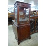 A mahogany display cabinet