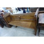 A Victorian carved oak linenfold church pew