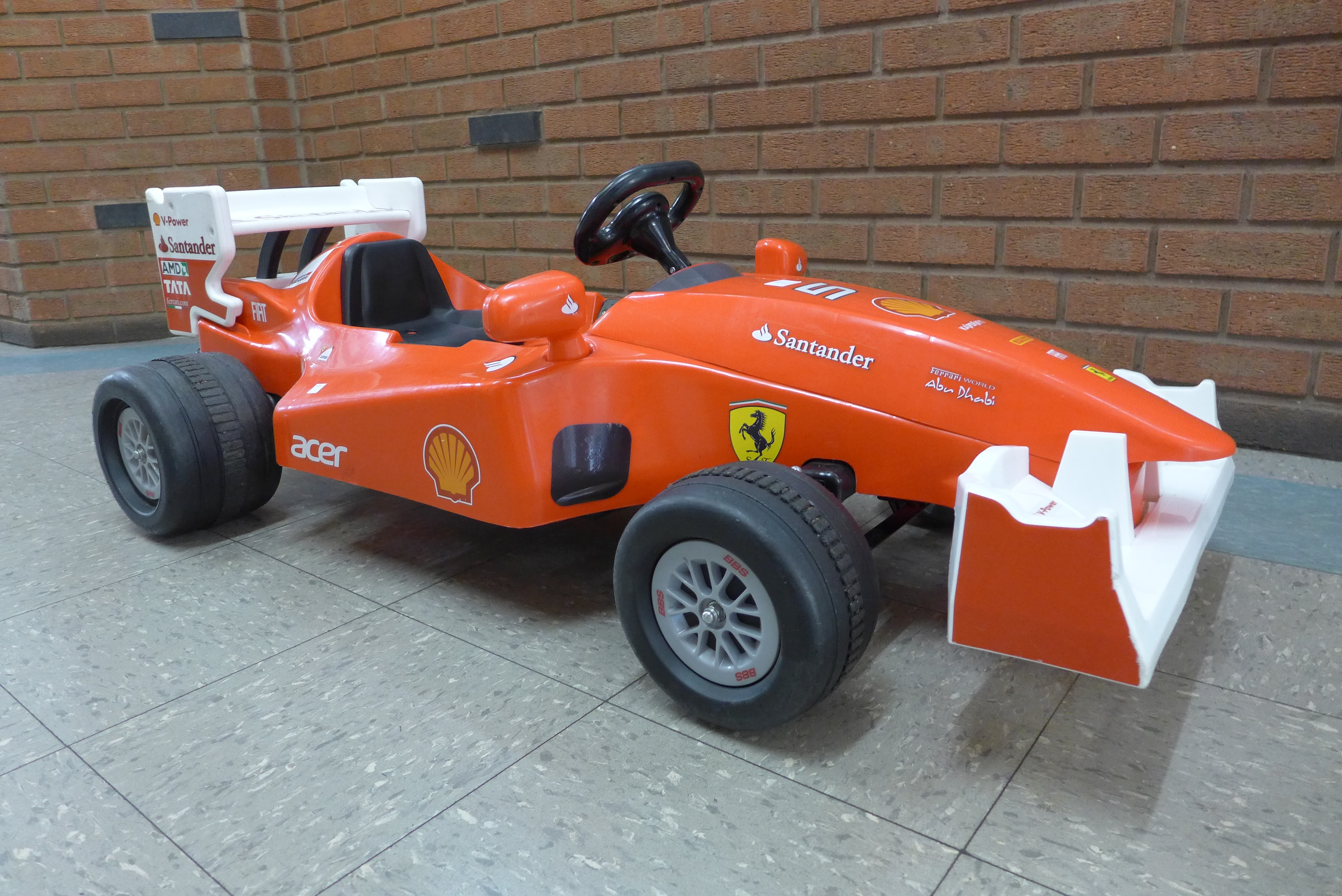 A limited edition Ferrari F1 Indy ride on car, Formula 1 W/12 volt battery power - with charging