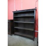 An Arts and Crafts oak open bookcase