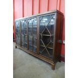 An Edward VII Maple & Co. mahogany and astragal glazed four door bookcase, 119cms h, 185cms w, 41cms