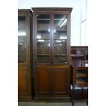 A large early 20th Century mahogany bookcase, 250cms h, 103cms w, 28cms d