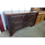 An Arts and Crafts mahogany sideboard