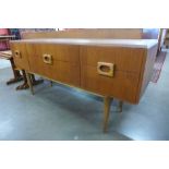 A teak six drawer sideboard