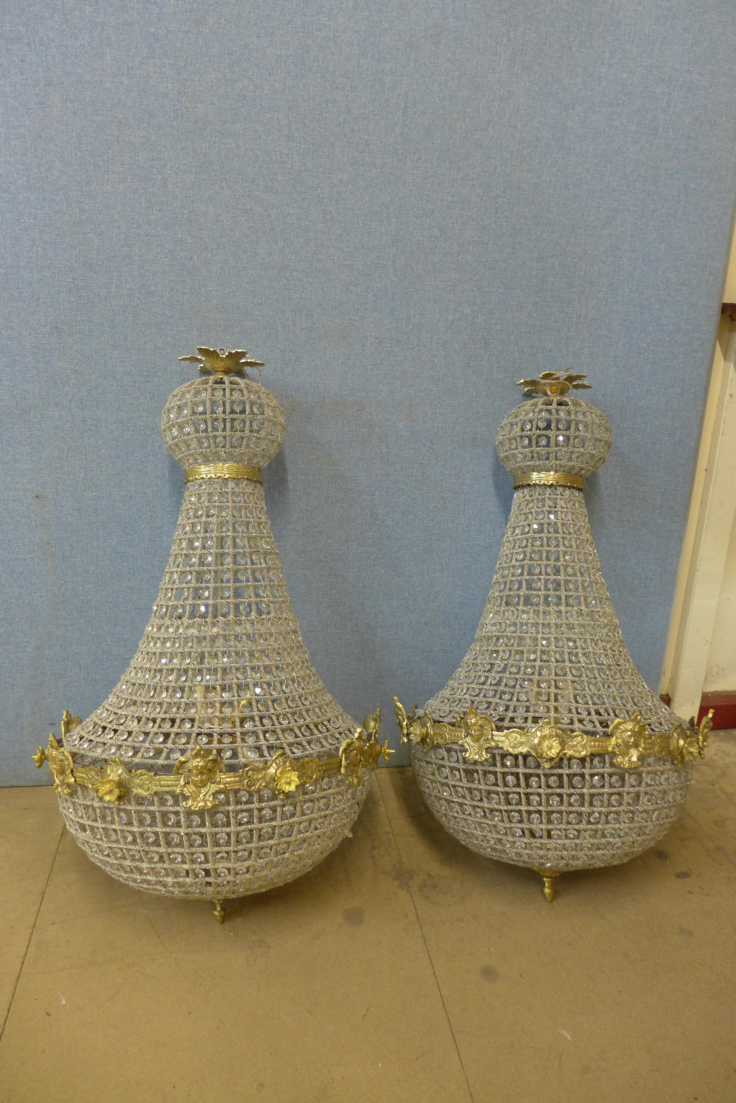 A pair of French Empire style bag shaped chandeliers, 88 x 55cms