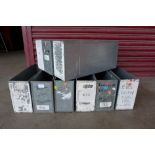 A set of nine industrial steel storage boxes