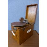 A Decca 'Trench Model 3' gramophone in wooden case and a box of gramophone accessories