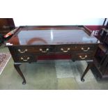 An Edward VII mahogany four drawer writing table