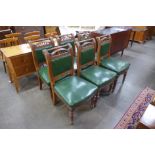 A set of six Victorian Aesthetic Movement carved oak and green leather chairs