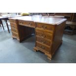 A George III style elm and walnut library desk