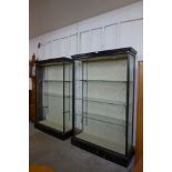 A pair of Victorian ebonised open shop display cabinets, 198cms h, 129cms w, 39cms d