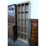 A tall Victorian pine pigeon hole cabinet