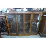 An Art Deco walnut breakfront display cabinet