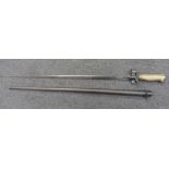 A French Lebel 1886/93/16 pattern bayonet, without quillion, with cruciform blade and metal turned