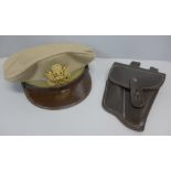 A WWII US Airforce peaked cap and a leather holster