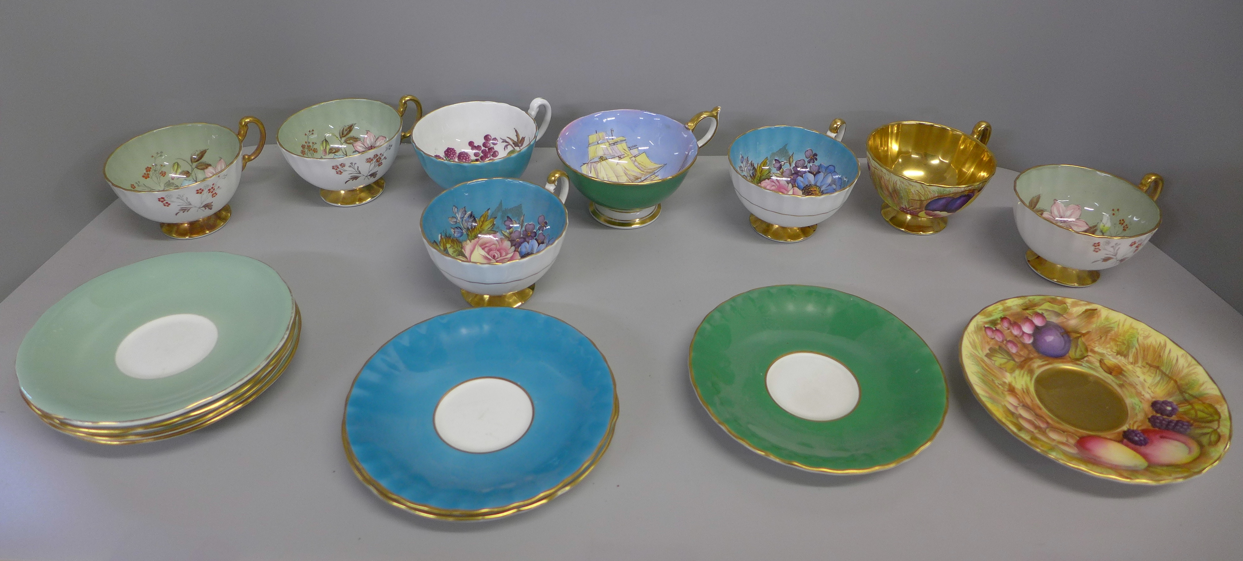 A collection of Aynsley cups and saucers including D Jones and L D Bailey