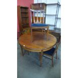 A G-Plan Fresco teak extending dining table and four G-Plan Brasilia dining chairs