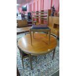 A G-Plan Fresco teak extending dining table and four chairs