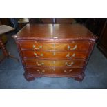 A Chippendale style hardwood serpentine commode