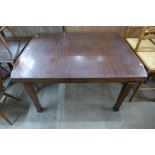 A mahogany draw-leaf dining table