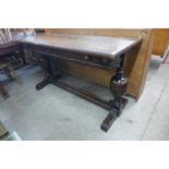 A 17th Century style oak extending refectory table